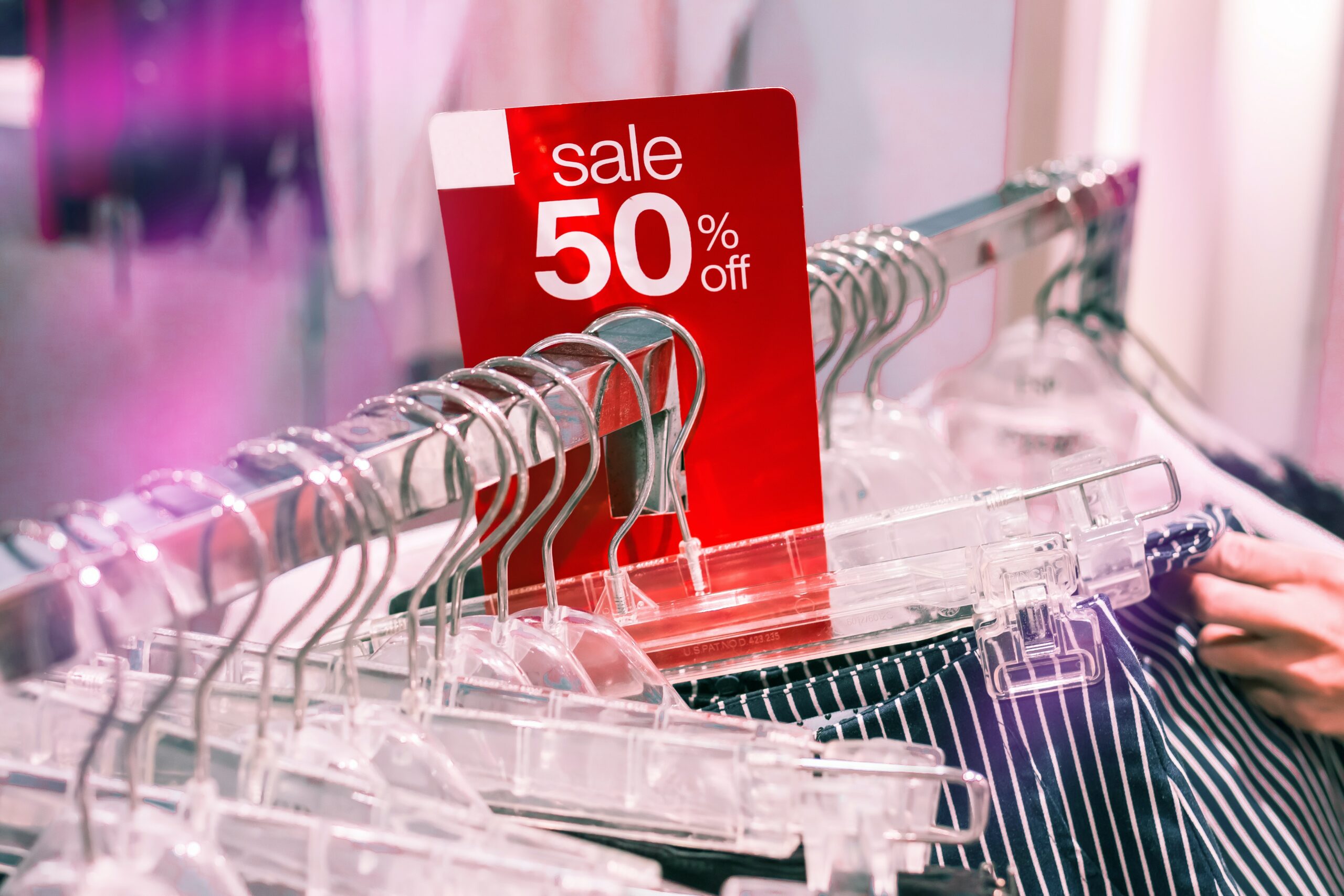 50% off sale in store with clothing rack